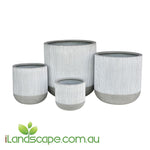 Set of four gray and white striped planters with a visible brand logo on a white background.