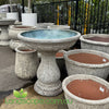 Ancient Bird Bath with textured stone-look finish and classic pedestal design