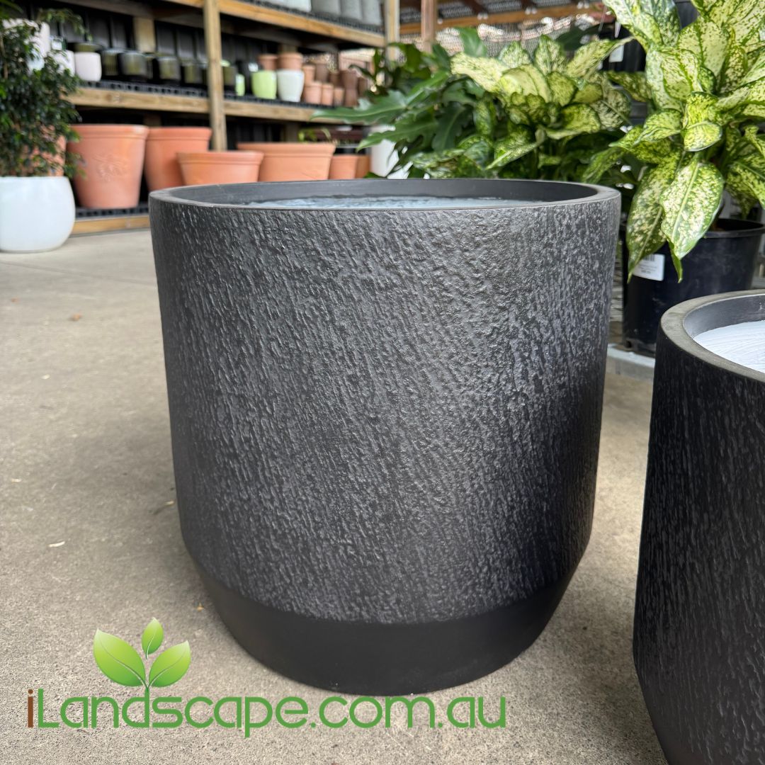 Textured black pot on a concrete floor with 'iLandscape.com.au' branding.